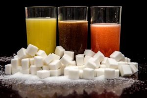 may-14-orange-cola-and-fruit-mix-carbonated-drinks-surrounded-by-sugar-cubes